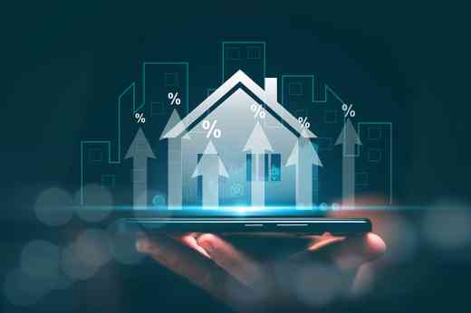 Hologramm eines Hauses auf einer Hand